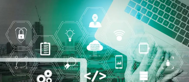 Hexagon icons for security, engineering, cloud and analytics overlaid on a city skyline and laptop