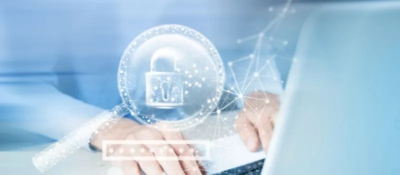 Hands typing on a laptop with a glowing padlock, network graphic and password field overlay